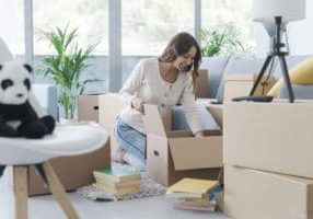 Woman unpacking in her new house